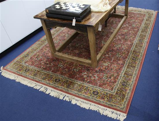 A Persian style hunting rug, 9ft 8in by 6ft 7in.